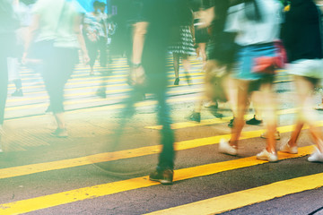 walking people on the busy city street with sunlight effect