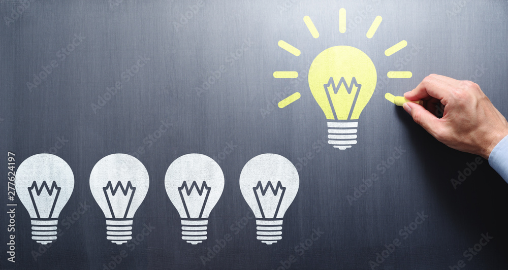 Poster succeed in finding solution. businessman drawing lightbulbs on chalkboard.