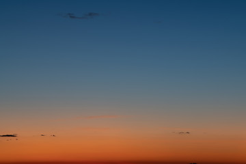Sky gradient from blue to orange sunset