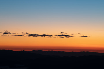 Fototapeta premium Sky gradient from blue to orange sunset