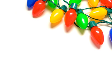Colorful Christmas lights on a white background