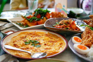 Southern of Thai food that delicious and spicy with variety of menu that placed on the marble table, top view