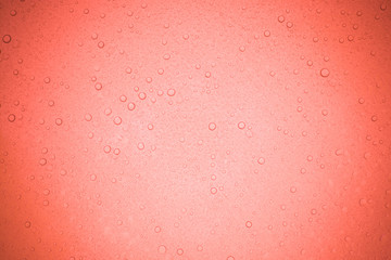 Rain droplets on red glass background, Water drops on glass.