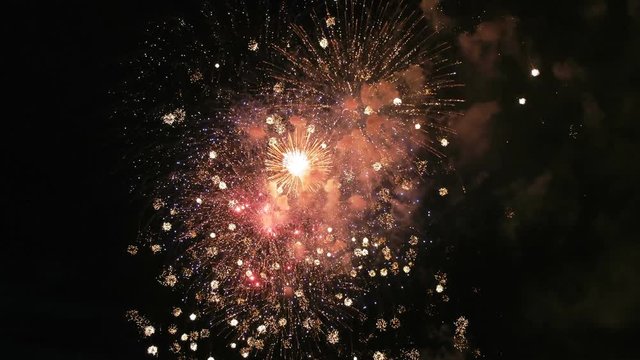 Colored fireworks in the dark sky, lots of beautiful big shot 4k