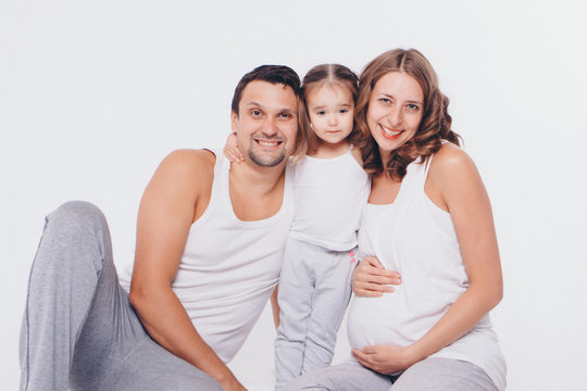 family photo on white background: parents spend time with children