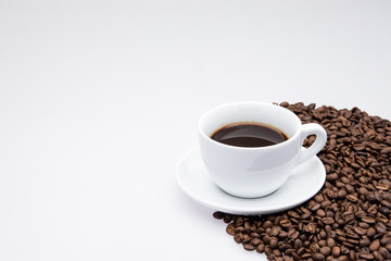 white cup of coffee with coffee bean on white background 