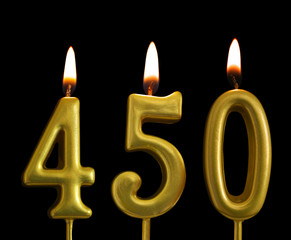 golden birthday candles on black background, number 450