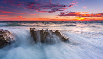 Fototapeta na wymiar Sunset over Rocks at Burns Beach, Perth, Western Australia
