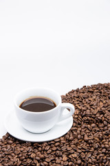 white cup of coffee with coffee bean on white background 
