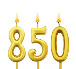 Golden birthday candles on black background, number 850
