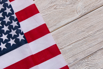 American flag on a wooden background. The concept of freedom and patriotism.