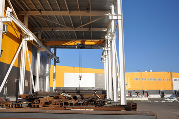 Naklejka premium Warehouse of raw materials, equipped with pumping and crane