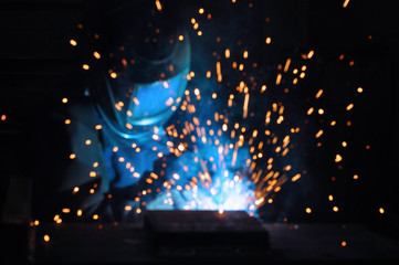electric welder brews steel at the factory.