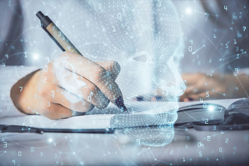 Double exposure of woman's writing hand on background with brain hologram. Concept of brainstorming.