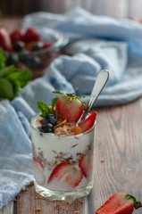 diet breakfast A glass of yogurt is filled with strawberries, blueberries and granola. different shooting options