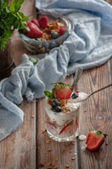 diet breakfast A glass of yogurt is filled with strawberries, blueberries and granola. different shooting options