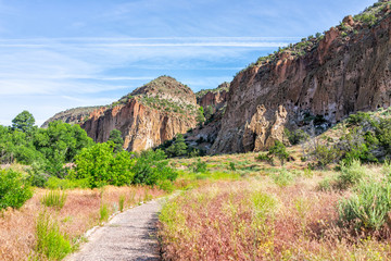 Naklejka premium Main Loop path trail in Bandelier National Monument in New Mexico in Los Alamos with canyon cliffs