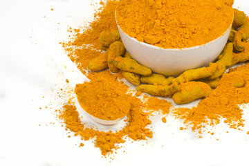Turmeric powder isolated on a white background