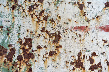 rusty corrosion on a metal base. Paint peeling off a metallic surface. Metal base rust, paint peeling off