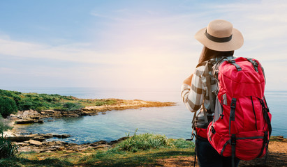 Asian woman backpack on sea , journey on holiday concept.