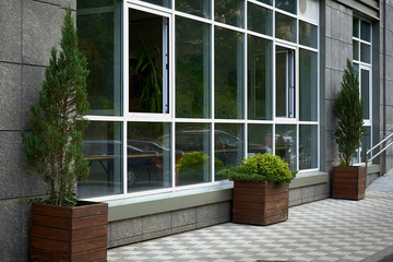 exterior of modern building with plants in pots