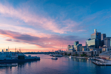 Modern cityscape with business office buildings and harbour at sunset