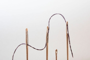 thread in the needles macro photo