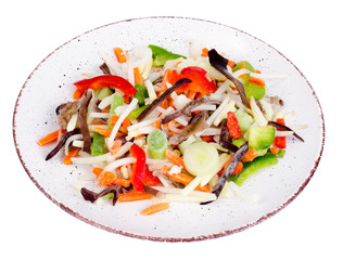 Mix vegetables with chinese mushrooms in bowl on light background