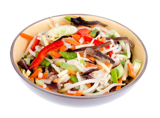 Mix vegetables with chinese mushrooms in bowl on light background