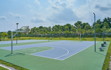 Outdoor open basketball court under sunny sky . Healthy lifestyle sport background .