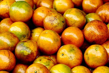 Orange,Fresh mandarin oranges fruit or tangerines with leaves, as background.