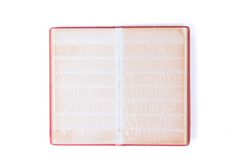 Closed old book for postage stamps isolated