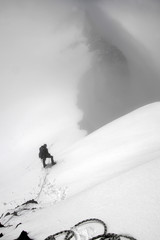 Mountainous landscape. A mountain climber with a rope in front of Aktru summit. North Chuya mountain range. Altai Republic, Siberia, Russia.