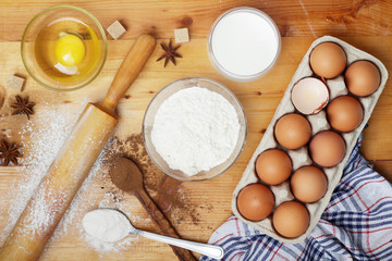 Food ingredients for baking: flour, eggs, milk, sugar