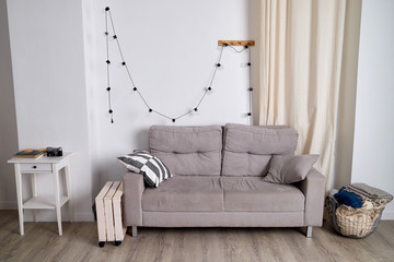 Interior of a modest living room with a sofa. Location for the photo shoot