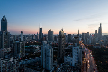 Fototapeta premium aerial view of buildings and highway interchange at dawn in Shanghai city