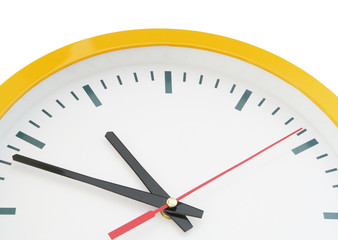 Round clock with black and red pointers isolated on white background