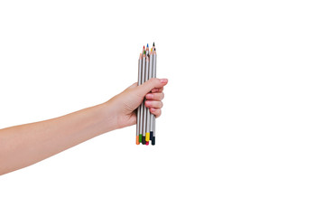 Woman's hand holding colofulr pencils isolated on white background.