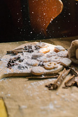 Sweet Biscuits on cutting board and canvas with powder on wooden table, vintage style. Royalty high quality free stock image.