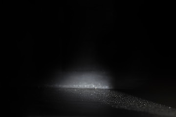 Light and shadow in a black room with empty space