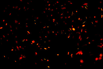flame of fire with sparks black background