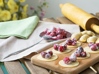 Delicious dumplings with cherries and sour cream. Summer, ripe cherry. It's time to make dumplings with cherries.