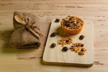 Delicious homemade egg tarts with cup of coffee.Coffee with egg tarts on wood table