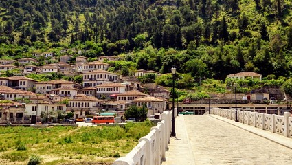 Panoramic view of Gorica bridge - old ottoman bridge over Osum river and old houses of Gorica district in the city of Berat, Albania. The albanian ancient city of Berat, UNESCO World Heritage