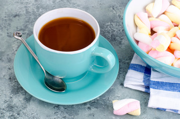 Hot chocolate in blue cup with marshmallows