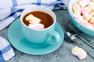 Hot chocolate in blue cup with marshmallows