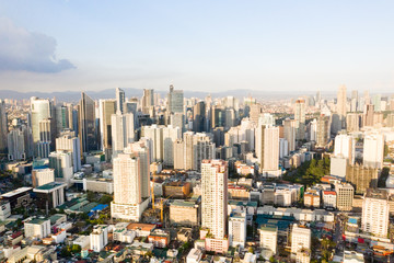 Modern city. The city of Manila, the capital of the Philippines. Modern metropolis in the morning, top view. Modern buildings in the city center.