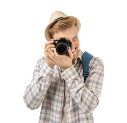 Young tourist with photo camera on white background