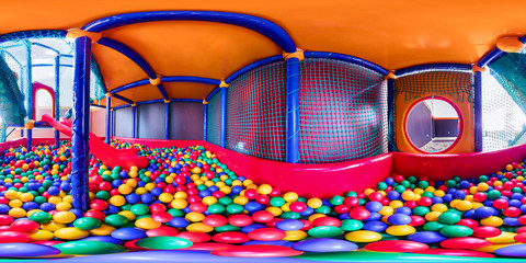 children's playroom with colorful balls and a slide made of plastic. Spherical panorama 360vr