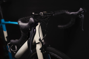 Fototapeta na wymiar Detail of bicycle components. Close up shifter, handlebar and front brake. Studio photo